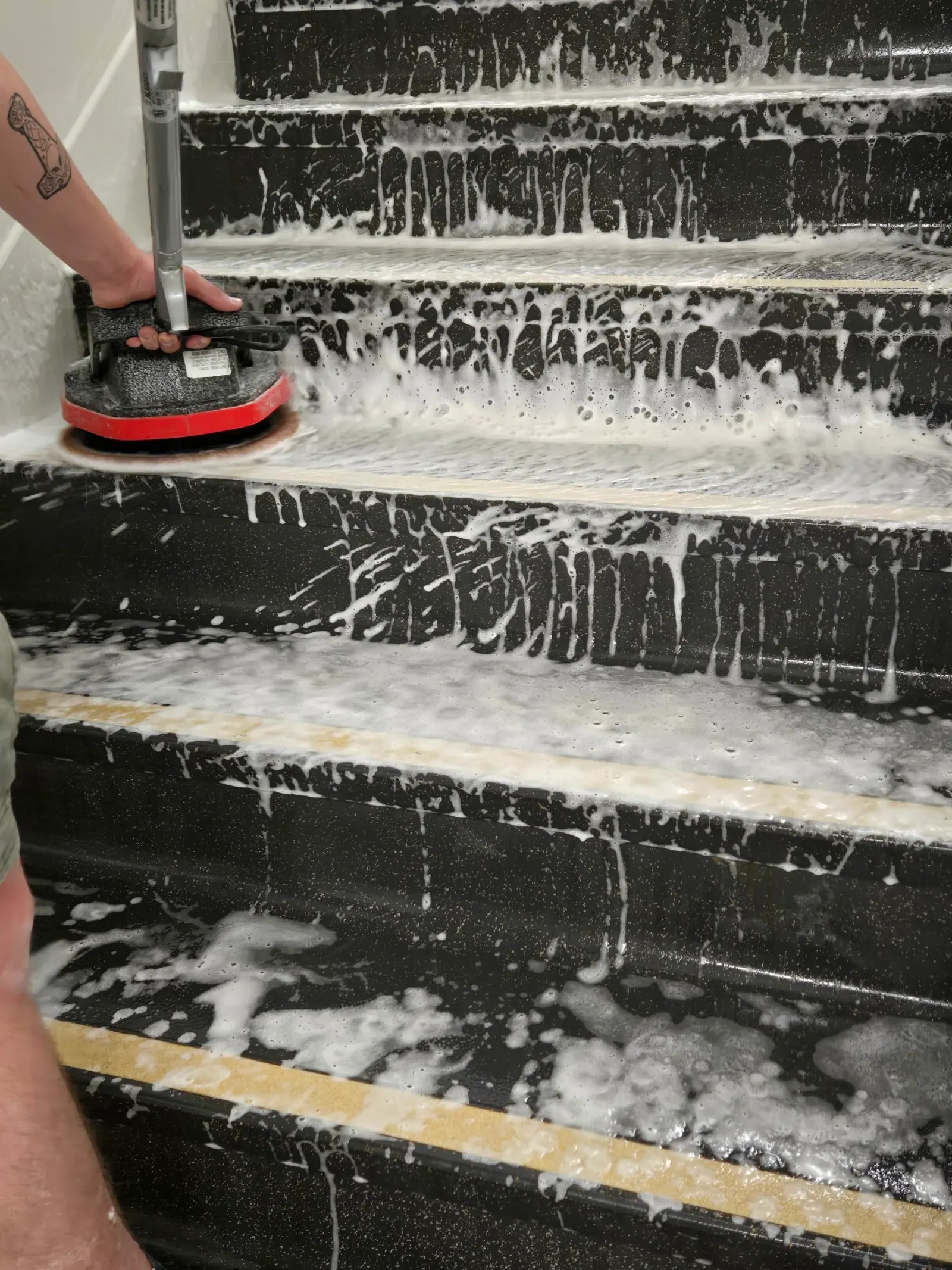 Stair treads under active foam during a stairwell deep service